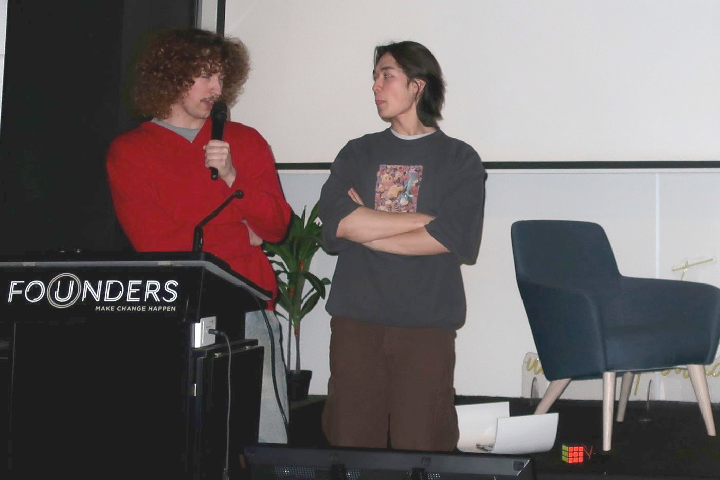 Eric and Jimmy of MakerMind Tutoring speaking at a robotics event
