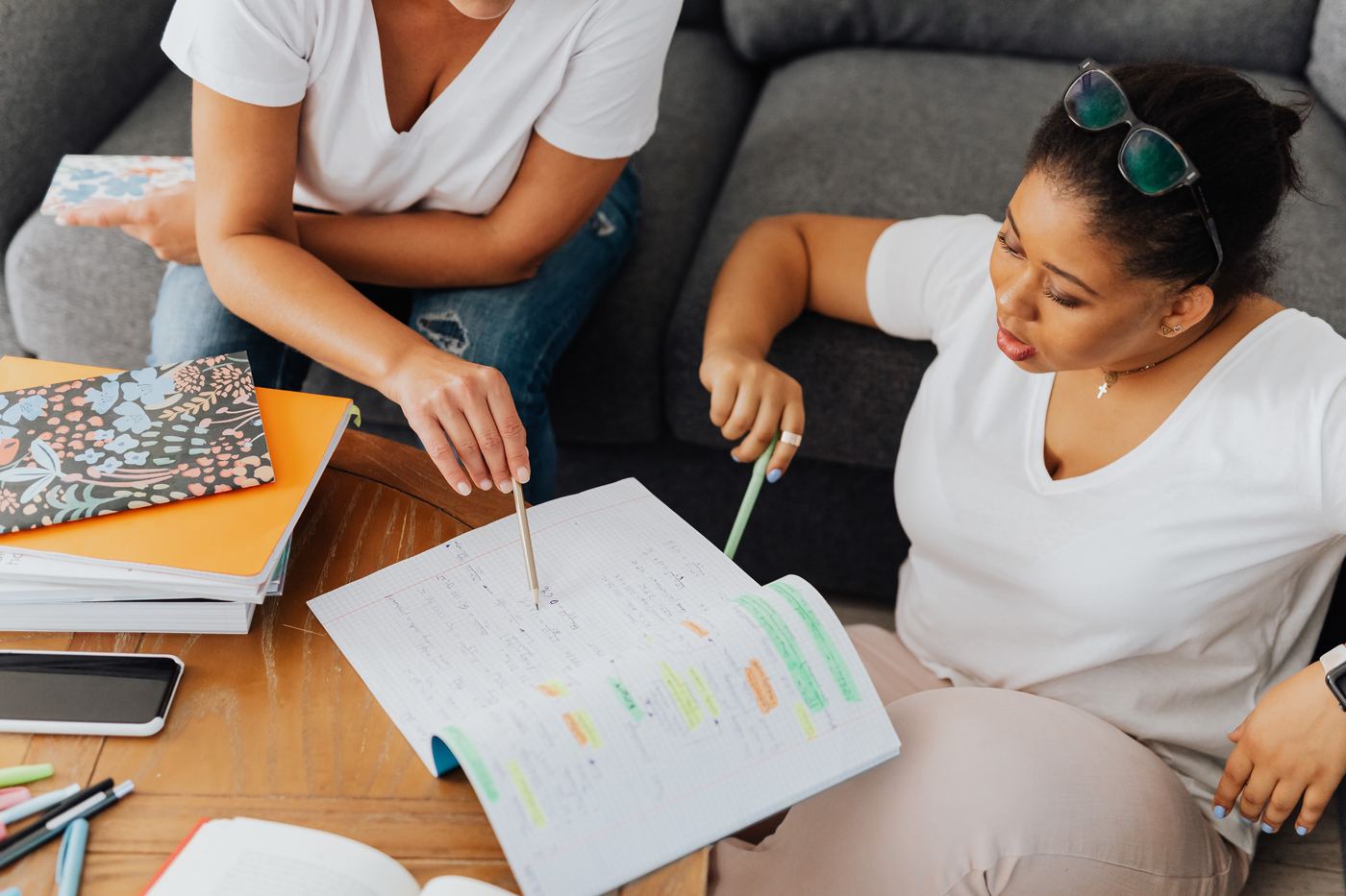 A tutor working through coursework with a student